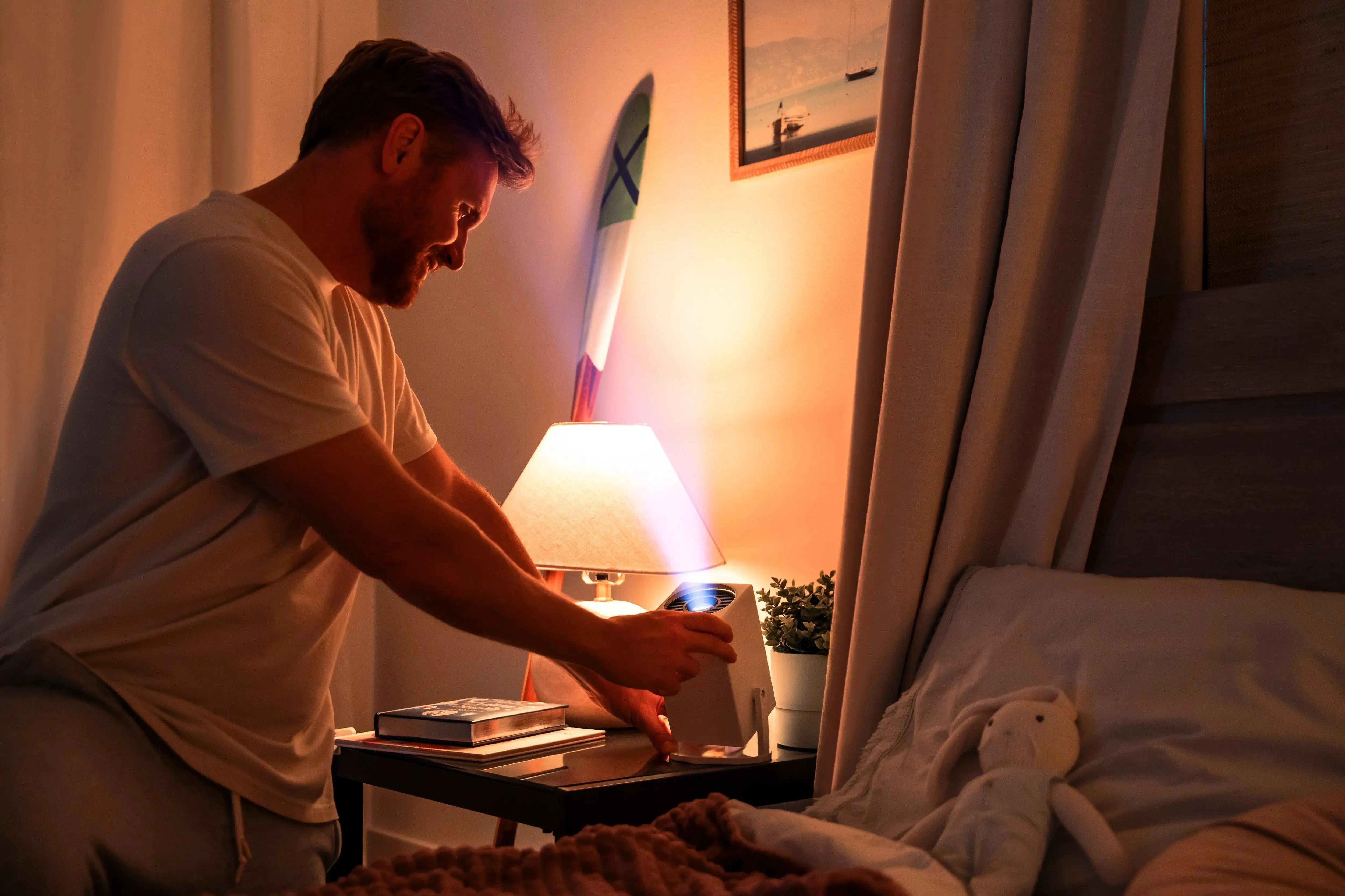 Father turning on the Ozmotic Learning Projector
