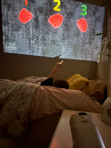 Ozmotic lesson projected onto a bedroom ceiling