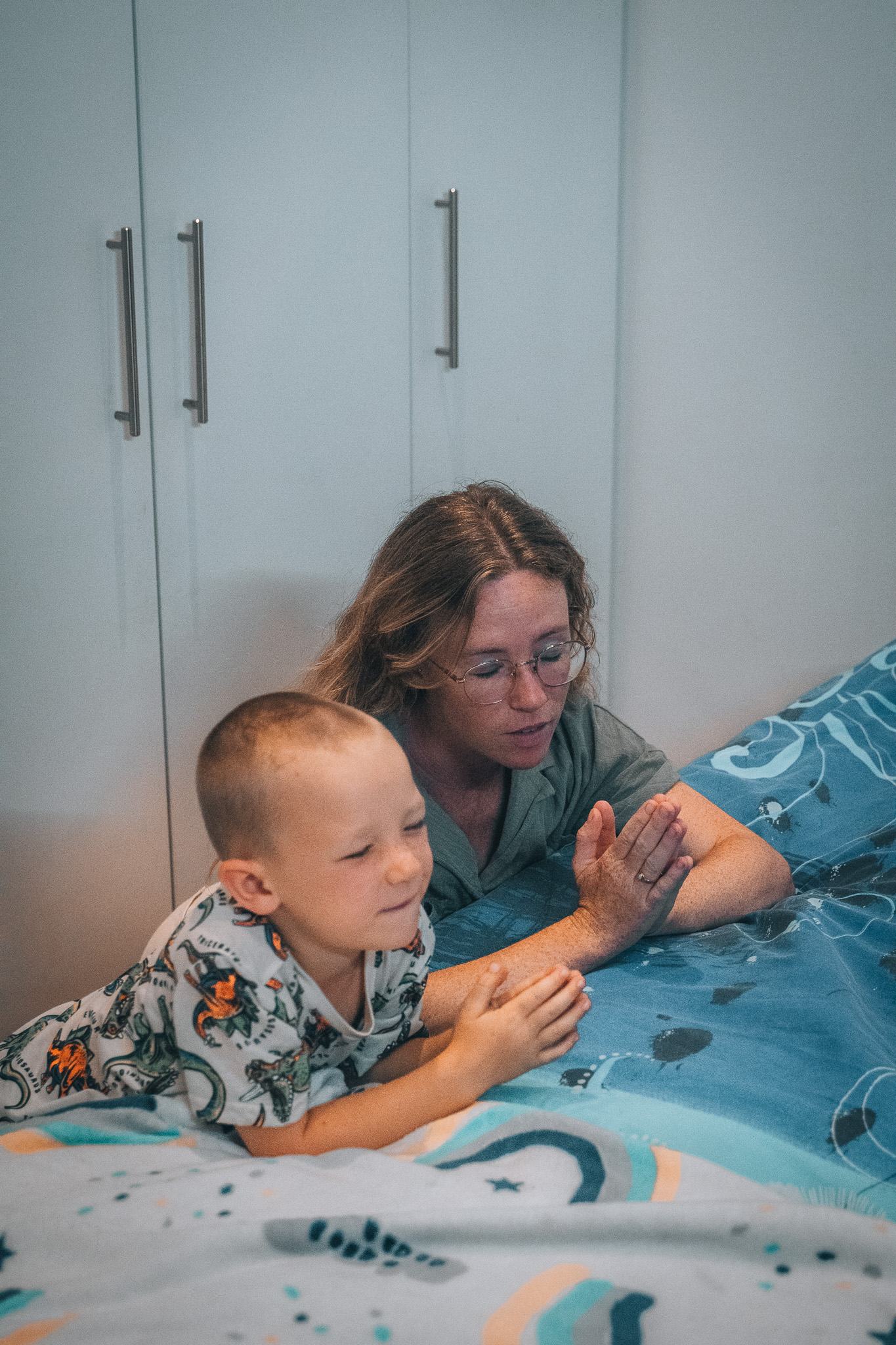 Child settling with calm projected meditation and reflection content before sleep