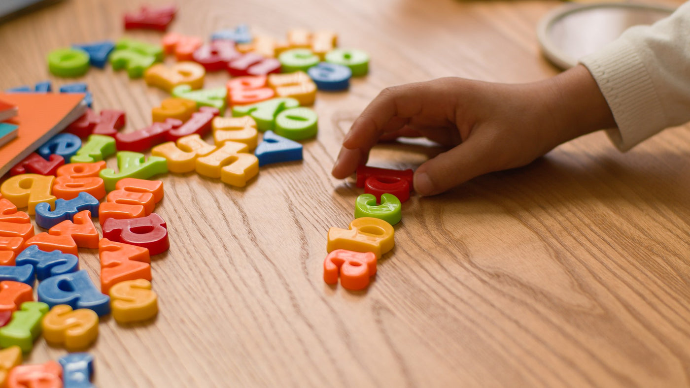 Toddler using calm projected foundational learning content at bedtime