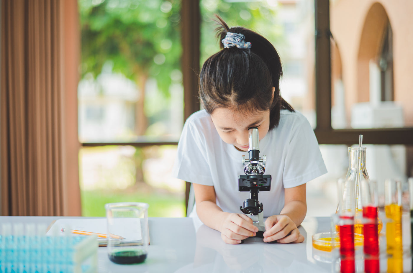Child exploring calm projected science content before sleep
